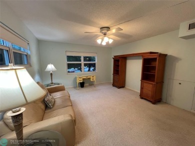 BACK ON MARKET 2nd FLOOR CORNER with WIDE GOLF/LAKE/POOL VIEW on Wynmoor Golf Course in Florida - for sale on GolfHomes.com, golf home, golf lot