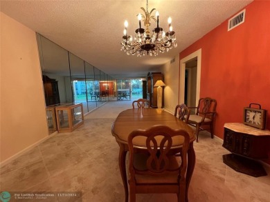 BACK ON MARKET 2nd FLOOR CORNER with WIDE GOLF/LAKE/POOL VIEW on Wynmoor Golf Course in Florida - for sale on GolfHomes.com, golf home, golf lot