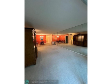 BACK ON MARKET 2nd FLOOR CORNER with WIDE GOLF/LAKE/POOL VIEW on Wynmoor Golf Course in Florida - for sale on GolfHomes.com, golf home, golf lot