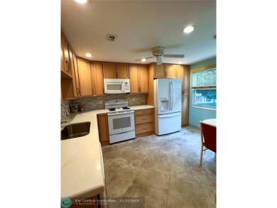 BACK ON MARKET 2nd FLOOR CORNER with WIDE GOLF/LAKE/POOL VIEW on Wynmoor Golf Course in Florida - for sale on GolfHomes.com, golf home, golf lot