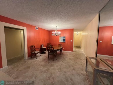 BACK ON MARKET 2nd FLOOR CORNER with WIDE GOLF/LAKE/POOL VIEW on Wynmoor Golf Course in Florida - for sale on GolfHomes.com, golf home, golf lot