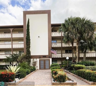 BACK ON MARKET 2nd FLOOR CORNER with WIDE GOLF/LAKE/POOL VIEW on Wynmoor Golf Course in Florida - for sale on GolfHomes.com, golf home, golf lot