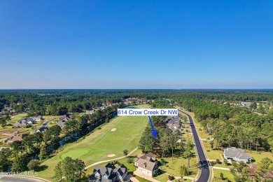 Welcome to coastal living at its finest in Crow Creek! This on Crow Creek Golf Club in North Carolina - for sale on GolfHomes.com, golf home, golf lot