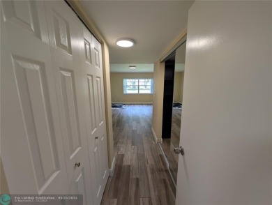This beautifully renovated 3-bedroom, 2-bathroom corner unit at on Woodmont Country Club in Florida - for sale on GolfHomes.com, golf home, golf lot