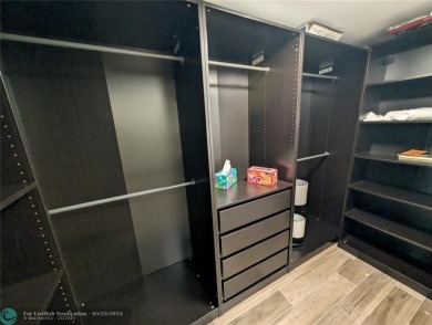 This beautifully renovated 3-bedroom, 2-bathroom corner unit at on Woodmont Country Club in Florida - for sale on GolfHomes.com, golf home, golf lot