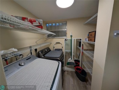 This beautifully renovated 3-bedroom, 2-bathroom corner unit at on Woodmont Country Club in Florida - for sale on GolfHomes.com, golf home, golf lot