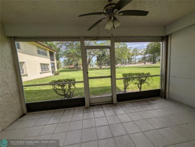 This beautifully renovated 3-bedroom, 2-bathroom corner unit at on Woodmont Country Club in Florida - for sale on GolfHomes.com, golf home, golf lot