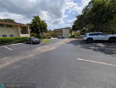This beautifully renovated 3-bedroom, 2-bathroom corner unit at on Woodmont Country Club in Florida - for sale on GolfHomes.com, golf home, golf lot