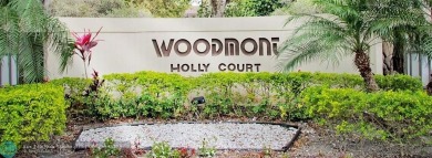 This beautifully renovated 3-bedroom, 2-bathroom corner unit at on Woodmont Country Club in Florida - for sale on GolfHomes.com, golf home, golf lot
