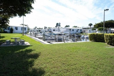 Imagine docking your 35 foot Boat behind your home. This on Windstar on Naples Bay in Florida - for sale on GolfHomes.com, golf home, golf lot