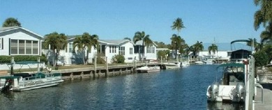 Imagine docking your 35 foot Boat behind your home. This on Windstar on Naples Bay in Florida - for sale on GolfHomes.com, golf home, golf lot