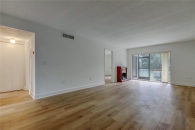 PRICED TO SELL!   This FIRST FLOOR condo located in desirable on East Lake Woodlands Country Club in Florida - for sale on GolfHomes.com, golf home, golf lot