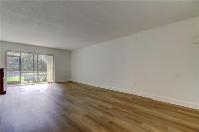 PRICED TO SELL!   This FIRST FLOOR condo located in desirable on East Lake Woodlands Country Club in Florida - for sale on GolfHomes.com, golf home, golf lot