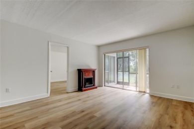 PRICED TO SELL!   This FIRST FLOOR condo located in desirable on East Lake Woodlands Country Club in Florida - for sale on GolfHomes.com, golf home, golf lot