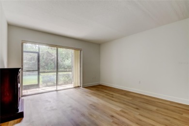 PRICED TO SELL!   This FIRST FLOOR condo located in desirable on East Lake Woodlands Country Club in Florida - for sale on GolfHomes.com, golf home, golf lot