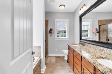 Discover this stunning 4-bedroom, 3-bath home located in the on Gates Four Golf and Country Club in North Carolina - for sale on GolfHomes.com, golf home, golf lot