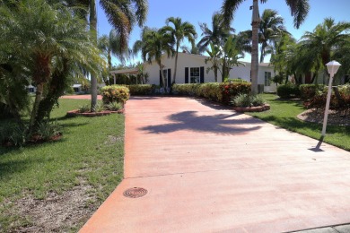 Absolutely stunning and one-of-a-kind corner lot with wraparound on Savanna Golf Club in Florida - for sale on GolfHomes.com, golf home, golf lot