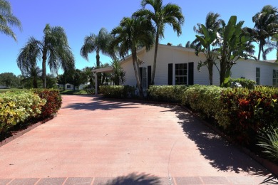 Absolutely stunning and one-of-a-kind corner lot with wraparound on Savanna Golf Club in Florida - for sale on GolfHomes.com, golf home, golf lot