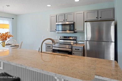 Bright & Fresh Condo with Golf & Pond Views | 2 BR, 2 BA Welcome on Members Club At St. James Plantation in North Carolina - for sale on GolfHomes.com, golf home, golf lot