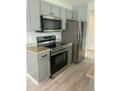 Bright & Fresh Condo with Golf & Pond Views | 2 BR, 2 BA Welcome on Members Club At St. James Plantation in North Carolina - for sale on GolfHomes.com, golf home, golf lot