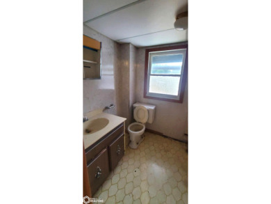 This property is an excellent investment opportunity for fix and on Aurelia Golf Club in Iowa - for sale on GolfHomes.com, golf home, golf lot