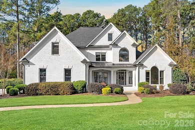 Set on a peaceful .85-acre cul-de-sac lot in the heart of The on Trump National Golf Club Charlotte in North Carolina - for sale on GolfHomes.com, golf home, golf lot