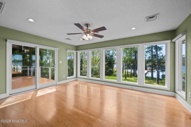 Enjoy spectacular sunsets from nearly every room in this on Harbour Point Golf Club in North Carolina - for sale on GolfHomes.com, golf home, golf lot