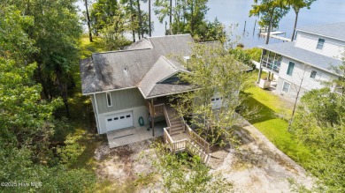 Enjoy spectacular sunsets from nearly every room in this on Harbour Point Golf Club in North Carolina - for sale on GolfHomes.com, golf home, golf lot