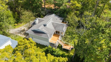 Enjoy spectacular sunsets from nearly every room in this on Harbour Point Golf Club in North Carolina - for sale on GolfHomes.com, golf home, golf lot