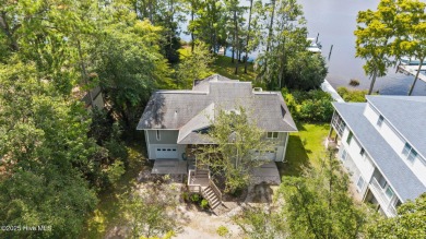 Enjoy spectacular sunsets from nearly every room in this on Harbour Point Golf Club in North Carolina - for sale on GolfHomes.com, golf home, golf lot