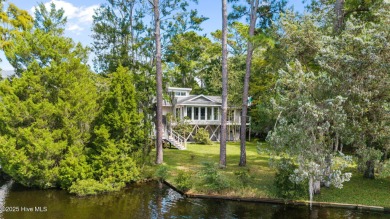 Enjoy spectacular sunsets from nearly every room in this on Harbour Point Golf Club in North Carolina - for sale on GolfHomes.com, golf home, golf lot