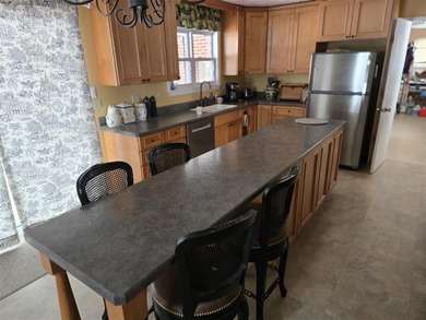 PRIVACY In Town.  Golfers can walk to #1 Tee and walk back home on Olive Glenn Golf and Country Club in Wyoming - for sale on GolfHomes.com, golf home, golf lot