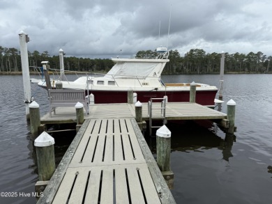 Enjoy spectacular sunsets from nearly every room in this on Harbour Point Golf Club in North Carolina - for sale on GolfHomes.com, golf home, golf lot