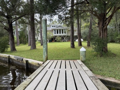 Enjoy spectacular sunsets from nearly every room in this on Harbour Point Golf Club in North Carolina - for sale on GolfHomes.com, golf home, golf lot