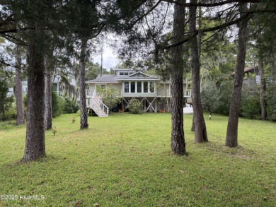 Enjoy spectacular sunsets from nearly every room in this on Harbour Point Golf Club in North Carolina - for sale on GolfHomes.com, golf home, golf lot