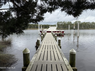 Enjoy spectacular sunsets from nearly every room in this on Harbour Point Golf Club in North Carolina - for sale on GolfHomes.com, golf home, golf lot