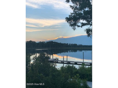 Enjoy spectacular sunsets from nearly every room in this on Harbour Point Golf Club in North Carolina - for sale on GolfHomes.com, golf home, golf lot