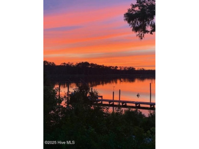 Enjoy spectacular sunsets from nearly every room in this on Harbour Point Golf Club in North Carolina - for sale on GolfHomes.com, golf home, golf lot