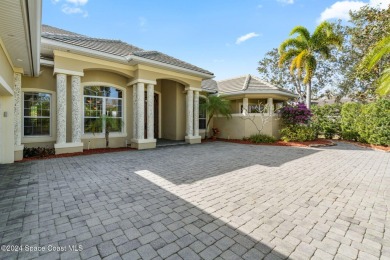 This stunning executive home exudes modern elegance and boasts on Baytree National Golf Links in Florida - for sale on GolfHomes.com, golf home, golf lot