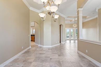 This stunning executive home exudes modern elegance and boasts on Baytree National Golf Links in Florida - for sale on GolfHomes.com, golf home, golf lot