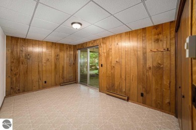 Nestled along the lush greens of Hidden Oaks Golf Course, this on Hidden Oaks Golf Course in Michigan - for sale on GolfHomes.com, golf home, golf lot