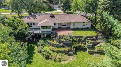 Nestled along the lush greens of Hidden Oaks Golf Course, this on Hidden Oaks Golf Course in Michigan - for sale on GolfHomes.com, golf home, golf lot