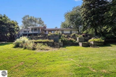 Nestled along the lush greens of Hidden Oaks Golf Course, this on Hidden Oaks Golf Course in Michigan - for sale on GolfHomes.com, golf home, golf lot