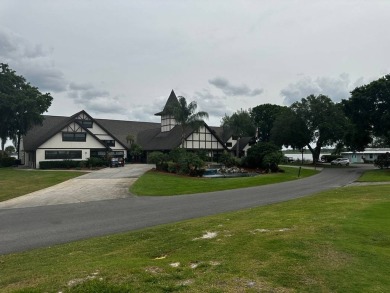 This Modern Treasure is a Beautiful Oasis!    This home is in on Lake Henry Golf Club in Florida - for sale on GolfHomes.com, golf home, golf lot