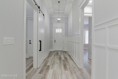 Step into this nearly new home where thoughtful design and on Brunswick Plantation and Golf Resorts in North Carolina - for sale on GolfHomes.com, golf home, golf lot