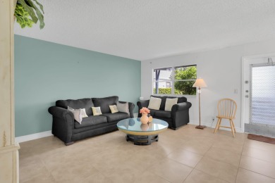 Welcome home to this charming first-floor corner 2-bedroom on Kings Point Golf - Executive in Florida - for sale on GolfHomes.com, golf home, golf lot