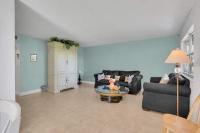 Welcome home to this charming first-floor corner 2-bedroom on Kings Point Golf - Executive in Florida - for sale on GolfHomes.com, golf home, golf lot