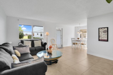 Welcome home to this charming first-floor corner 2-bedroom on Kings Point Golf - Executive in Florida - for sale on GolfHomes.com, golf home, golf lot