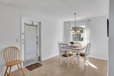 Welcome home to this charming first-floor corner 2-bedroom on Kings Point Golf - Executive in Florida - for sale on GolfHomes.com, golf home, golf lot
