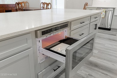 Step into this nearly new home where thoughtful design and on Brunswick Plantation and Golf Resorts in North Carolina - for sale on GolfHomes.com, golf home, golf lot